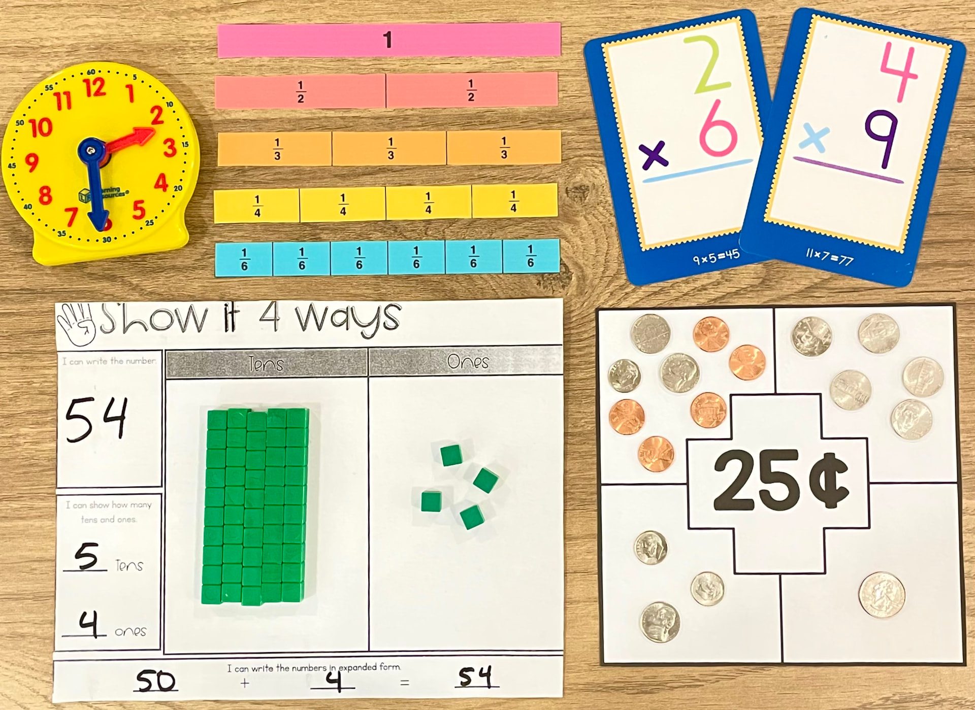 Mid-elementary math materials for fractions, time, multiplication, place value, and counting coins